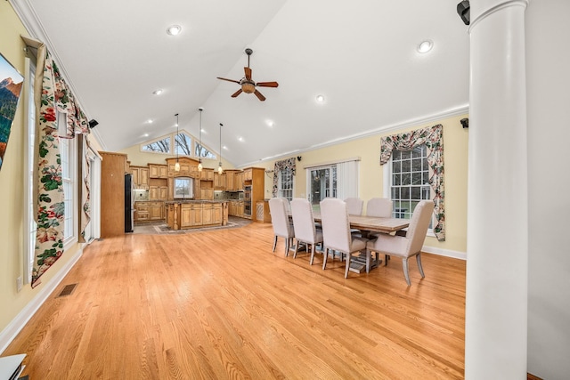 unfurnished dining area featuring a ceiling fan, light wood-type flooring, visible vents, and lofted ceiling