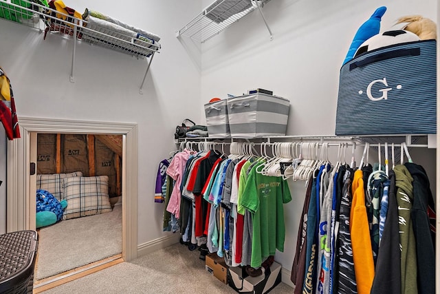 walk in closet featuring carpet