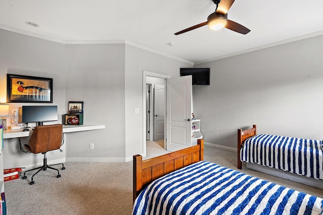 carpeted bedroom with ceiling fan, baseboards, and crown molding