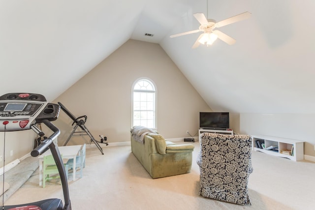 interior space with lofted ceiling, carpet floors, a ceiling fan, and baseboards