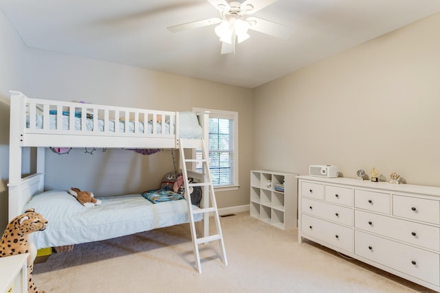 bedroom with light carpet and ceiling fan