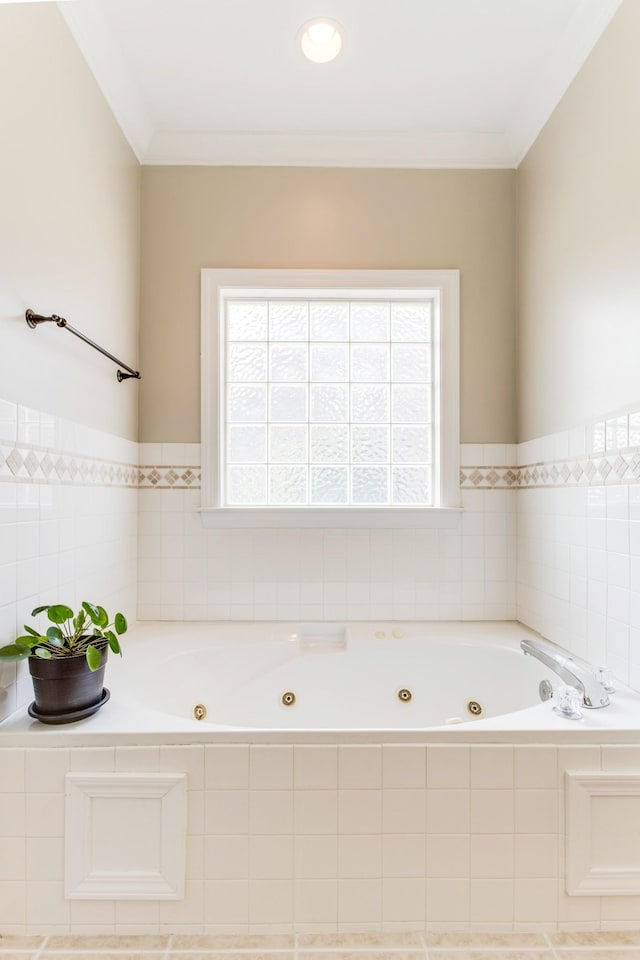 full bathroom with a whirlpool tub and ornamental molding