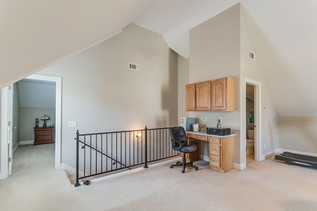 home office featuring baseboards, high vaulted ceiling, visible vents, and light colored carpet