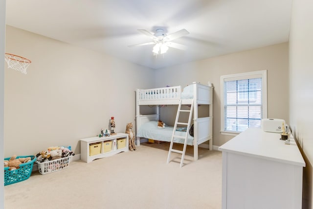 bedroom featuring a ceiling fan and light colored carpet