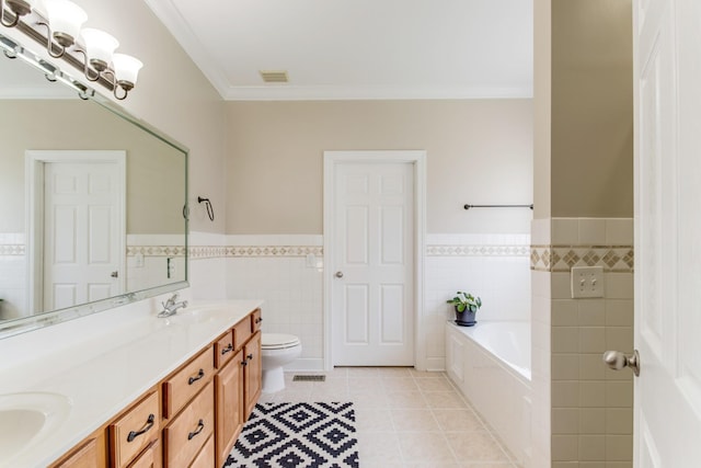 bathroom featuring a garden tub, double vanity, ornamental molding, a sink, and tile patterned flooring