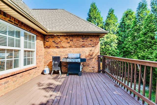 wooden deck featuring area for grilling