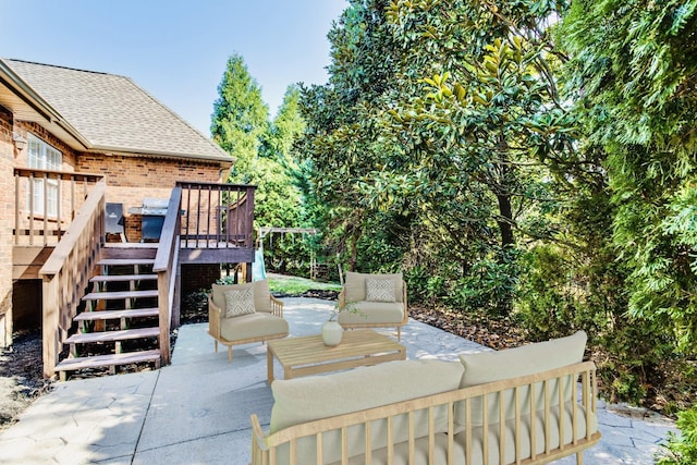 view of patio / terrace featuring a deck and stairway