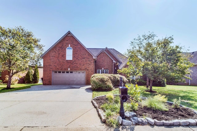 traditional home featuring a front lawn, a garage, brick siding, and driveway