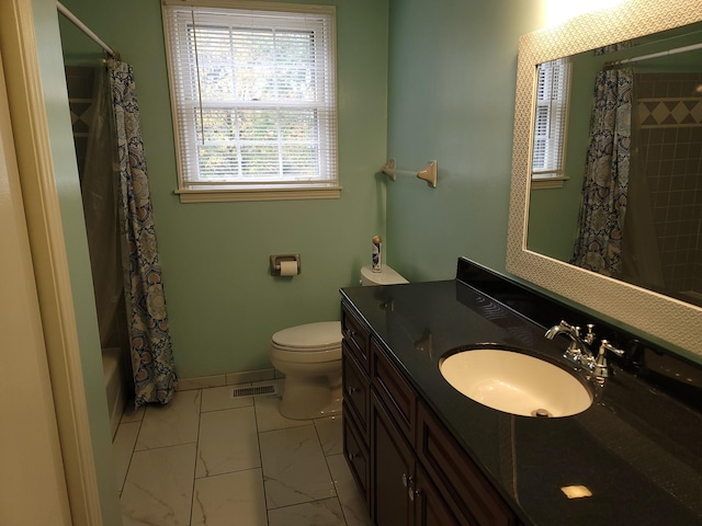 bathroom with toilet, visible vents, vanity, baseboards, and marble finish floor