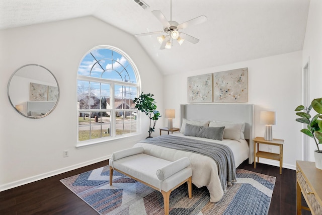 bedroom featuring lofted ceiling, baseboards, visible vents, and dark wood finished floors