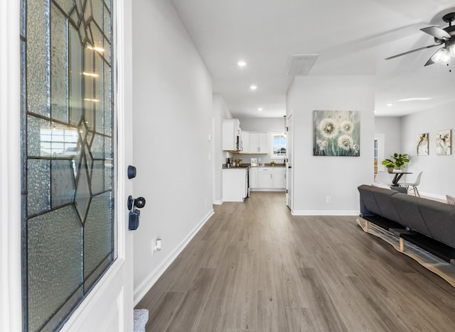 entryway with baseboards, dark wood finished floors, a ceiling fan, and recessed lighting