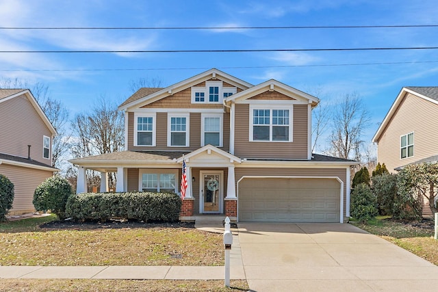 craftsman inspired home featuring an attached garage, concrete driveway, and brick siding