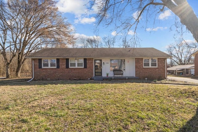 ranch-style house with crawl space, a front yard, and brick siding