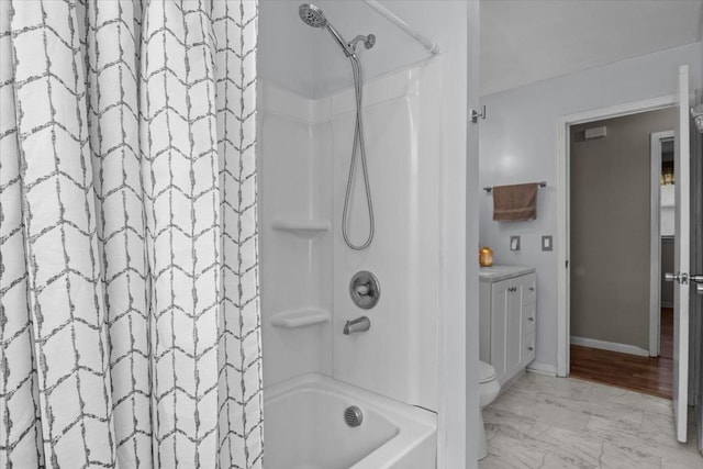 full bathroom featuring baseboards, vanity, and shower / tub combo with curtain