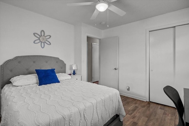 bedroom featuring ceiling fan, a closet, and wood finished floors