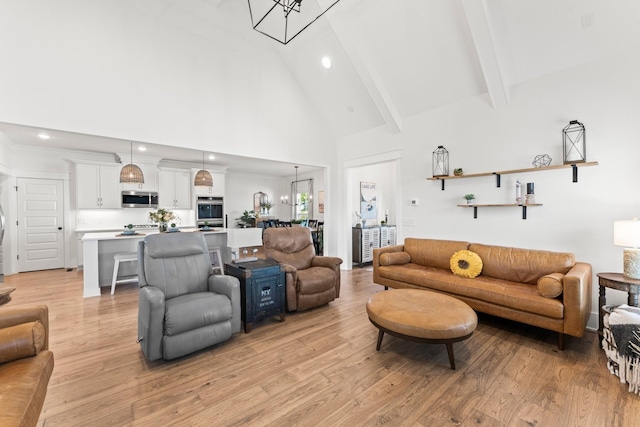 living area with light wood-style flooring, high vaulted ceiling, beamed ceiling, and recessed lighting