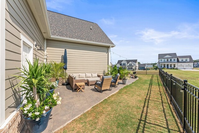 view of yard featuring a fenced backyard, a patio, and an outdoor living space