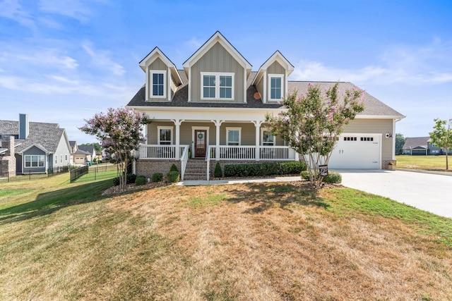 view of front of property featuring a porch, concrete driveway, an attached garage, board and batten siding, and a front lawn