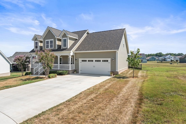 view of front of property with board and batten siding, concrete driveway, a porch, and a front lawn