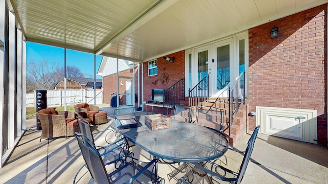 view of patio / terrace with outdoor dining area and fence