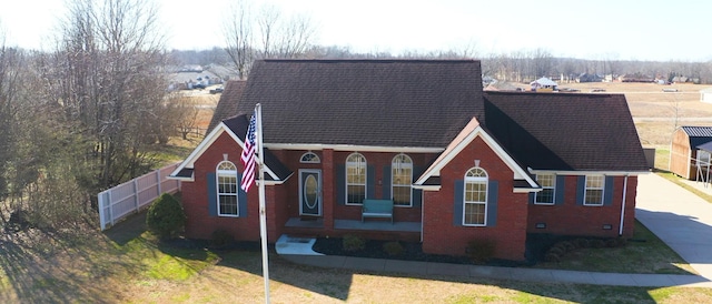 view of front of house featuring a front yard and brick siding