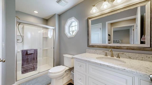 full bath featuring visible vents, a shower stall, toilet, and vanity