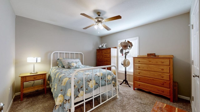 carpeted bedroom featuring a ceiling fan and baseboards