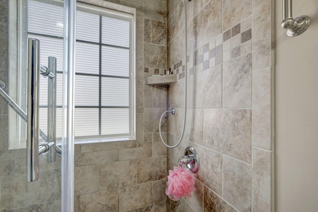 full bath featuring tiled shower