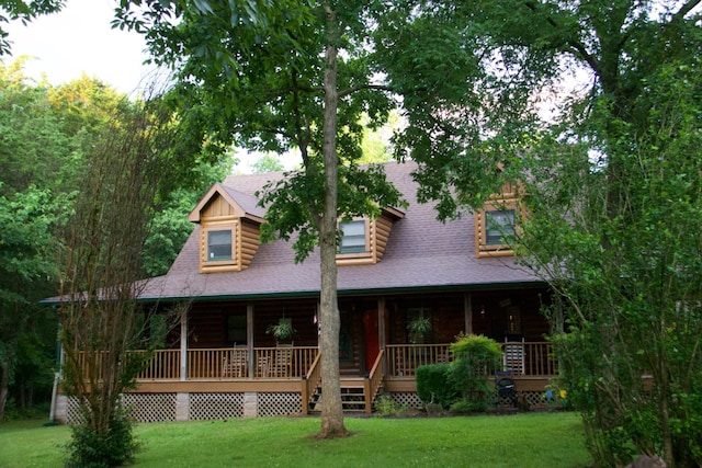 8956 Rocky Fork Almaville Rd, Smyrna, TN 37167 - log cabin featuring a front yard, covered porch, log siding, and roof with shingles