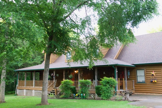8956 Rocky Fork Almaville Rd, Smyrna, TN 37167 - view of front of home with a porch, a front lawn, faux log siding, and roof with shingles