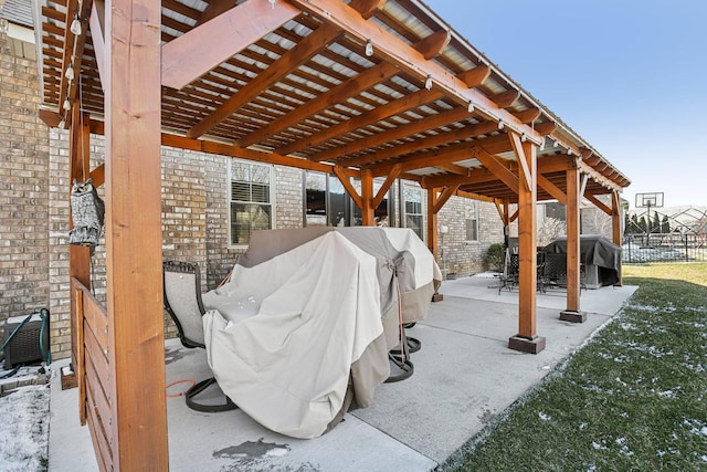 view of patio / terrace featuring grilling area, fence, and a pergola