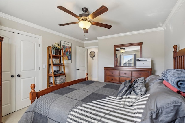 bedroom featuring ornamental molding, a closet, carpet floors, and a ceiling fan