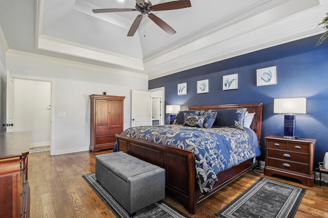 bedroom with ceiling fan, crown molding, baseboards, and wood finished floors