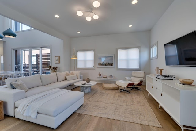 living room with wood finished floors and recessed lighting