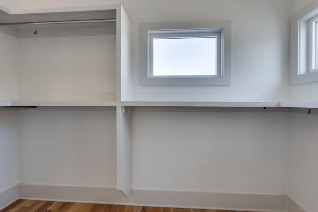 spacious closet with wood finished floors