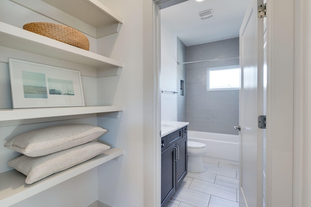 bathroom with visible vents, toilet, tile patterned floors, bathtub / shower combination, and vanity