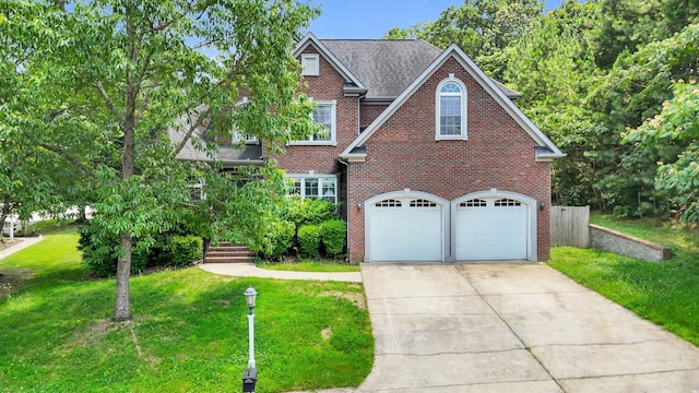 1108 City View Ter, Chattanooga, TN 37421 - traditional-style house featuring brick siding, concrete driveway, a front yard, and a garage