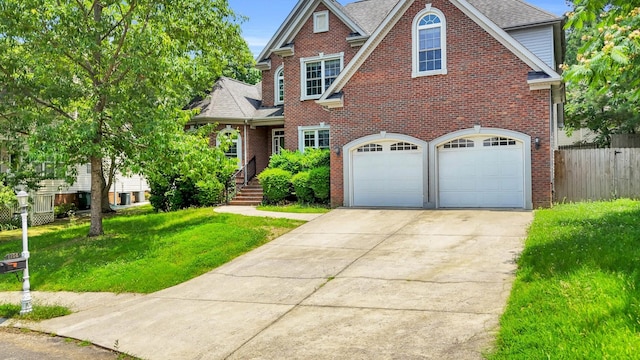 1108 City View Ter, Chattanooga, TN 37421 - traditional-style home with driveway, a garage, brick siding, and a shingled roof