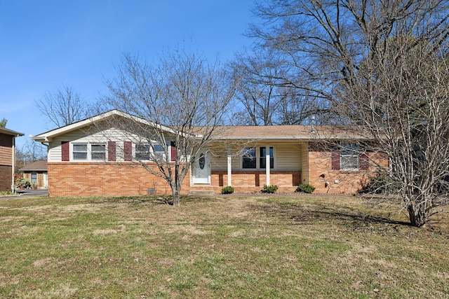 ranch-style home with crawl space, brick siding, and a front lawn