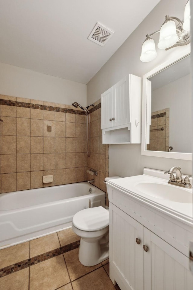 full bath featuring visible vents, toilet, tile patterned flooring, vanity, and shower / washtub combination