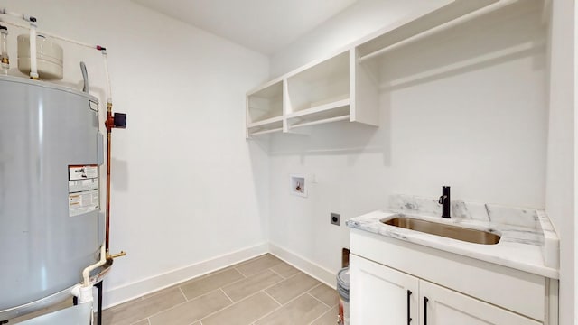 laundry area with washer hookup, a sink, baseboards, water heater, and electric dryer hookup