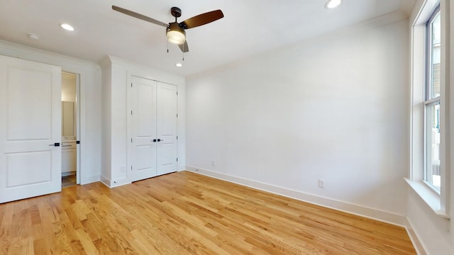 unfurnished bedroom featuring recessed lighting, light wood-type flooring, and baseboards