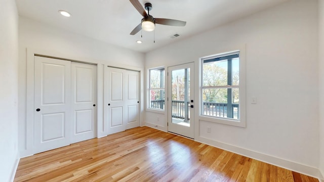 doorway to outside with light wood finished floors, recessed lighting, visible vents, ceiling fan, and baseboards