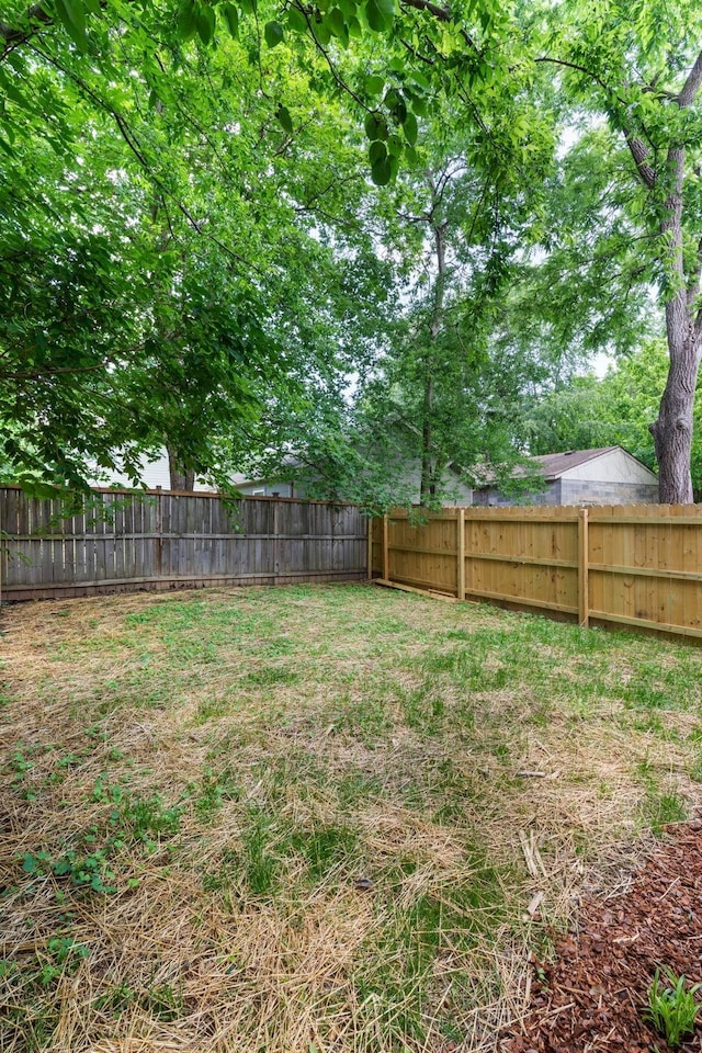 view of yard with a fenced backyard