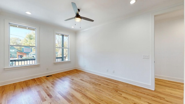 empty room featuring recessed lighting, a ceiling fan, visible vents, baseboards, and light wood finished floors