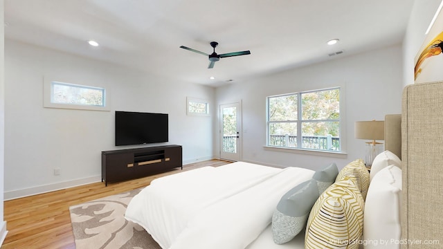 bedroom featuring recessed lighting, visible vents, baseboards, and wood finished floors