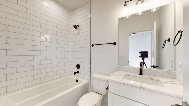 bathroom with toilet, vanity, and shower / bathing tub combination