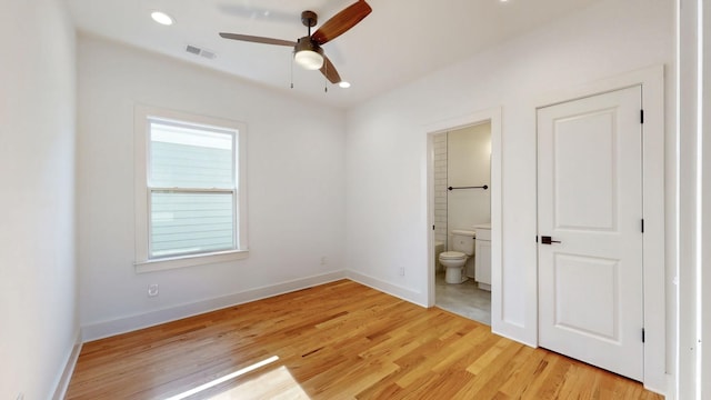 unfurnished bedroom with recessed lighting, visible vents, light wood-style floors, connected bathroom, and baseboards