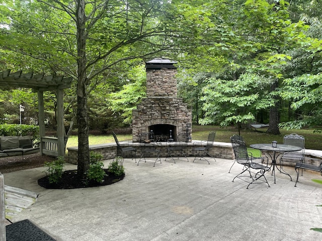 view of patio / terrace with an outdoor stone fireplace