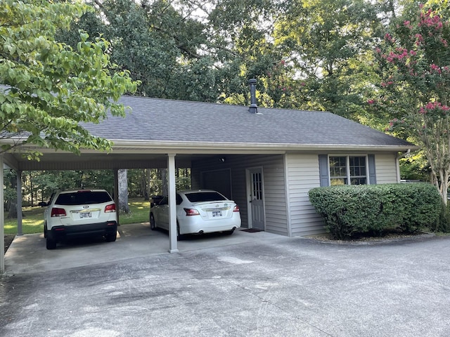 view of car parking with a carport and concrete driveway